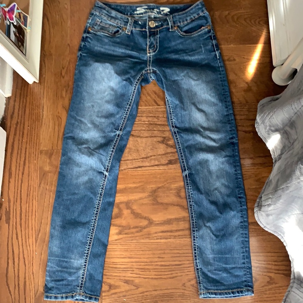 Mid/low rise dark wash straight leg jeans